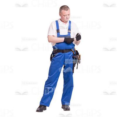 Cutout Photo of Focused Repairman Studying a Wrench-0