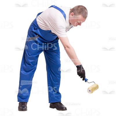 Cutout Photo of Middle-aged Builder Dipping a Roller in a Paint Bucket-0
