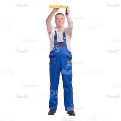 Focused Workman Raised Up a Ruler Cutout Image-0