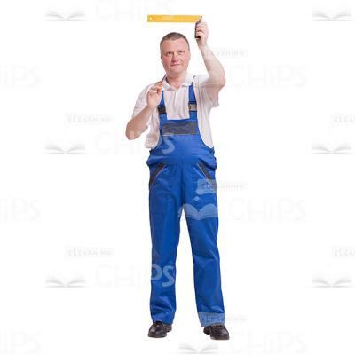 Pleased Builder Holding a Ruler in the Air Cutout Image-0