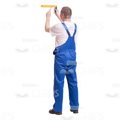 Cutout Image of Middle-aged Builder Standing His Back and Using a Ruler-0