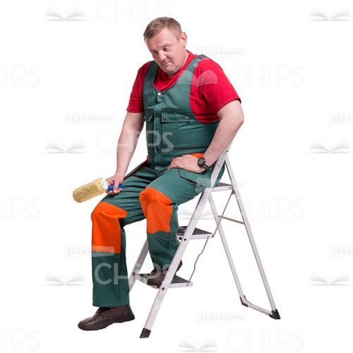 Thoughtful Repairman with a Paint Roller Sitting on the Ladder Cutout Picture-0