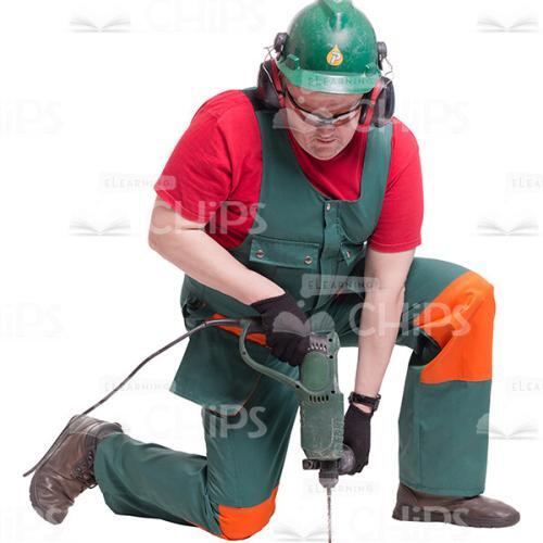 Cutout Photo of Middle-age Handyman Kneeling, Drilling and Working Hard-0