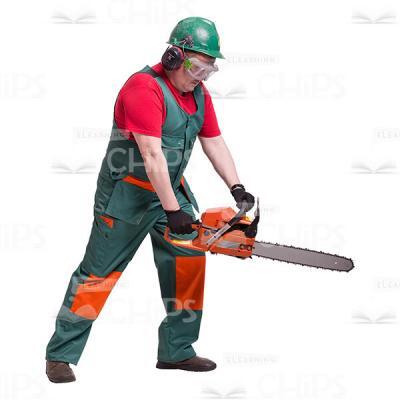 Profile View of Focused Handyman Sawing with Chain Saw Cutout Photo-0