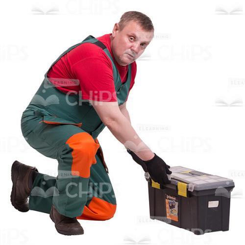 Standing On One Knee Middle-aged Repairman In Front Of The Instrument Box Cutout Picture-0