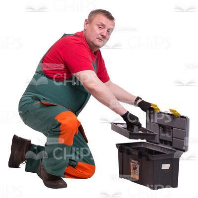 Middle-aged Repairman Packing The Instrument Box Cutout Picture-0