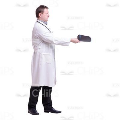 Cutout Photo of Middle-aged Doctor Standing Half-turned and Extending X-rays with His Right Hand-0