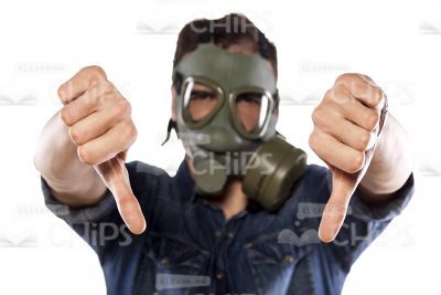 Man Wearing Gas Mask And Showing Thumbs Down Gesture Stock Photo-0