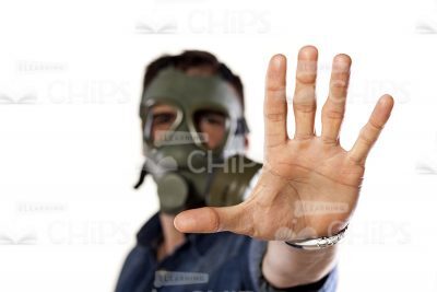 Close Up Stock Photo Of Young Man In Gas Mask Stretches Out His Hand-0
