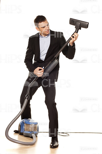 Young Business Man Using Vacuum Cleaner Stock Photo Pack-32028