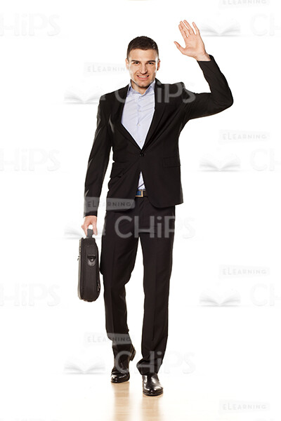 Businessman With Briefcase Waving Hand Stock Photo-0