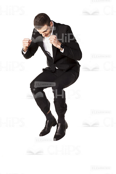 Emotional Businessman Jumps Up On Ground Stock Photo-0