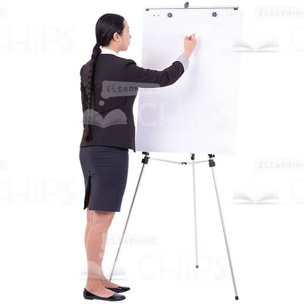 Calm Asian Woman Writing On Flipchart With Paper Cutout Photo-0