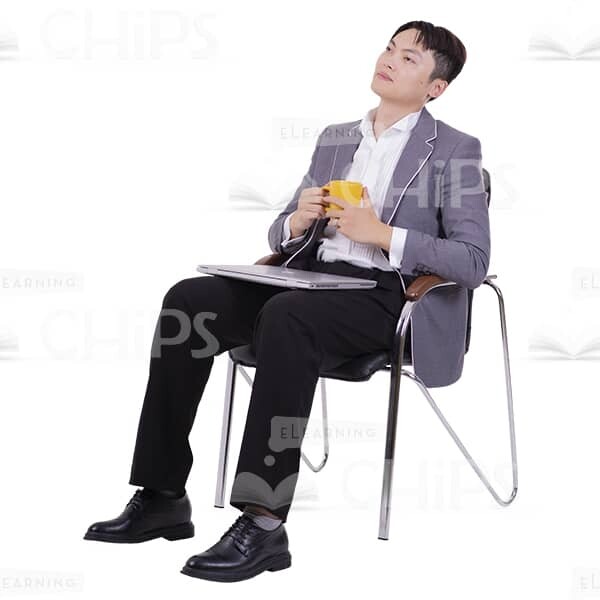 Thoughtful Asian Man Sitting and Holding Cup with Both Hands Cutout Image-0