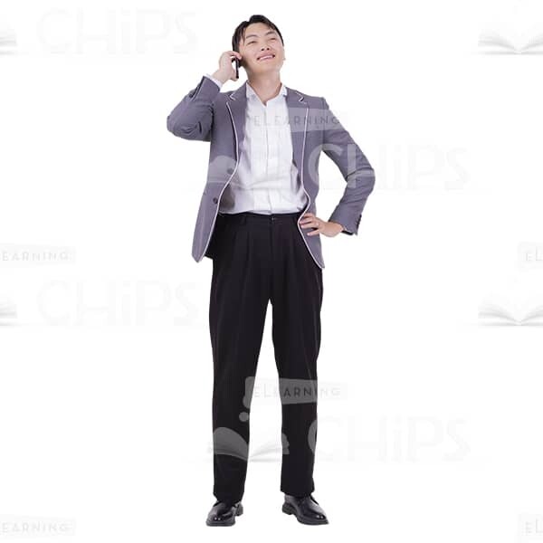 Happy Asian Man Answers A Call On A Smartphone Image Cutout-0