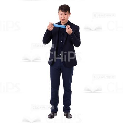 Asian Guy Holds The Mask By The Elastic Bands Cutout Photo-0