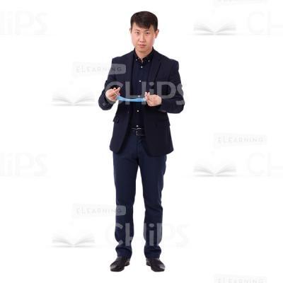 Asian Man Standing With Blue Mask In Arms Picture Cutout-0