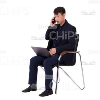 Serious Cutout Asian Man Busy With Laptop Talking On the Phone-0