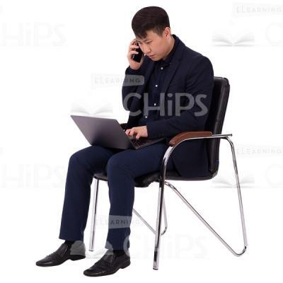 Half-Turned Cutout Man Typing On Notebook With Phone In Right Hand-0