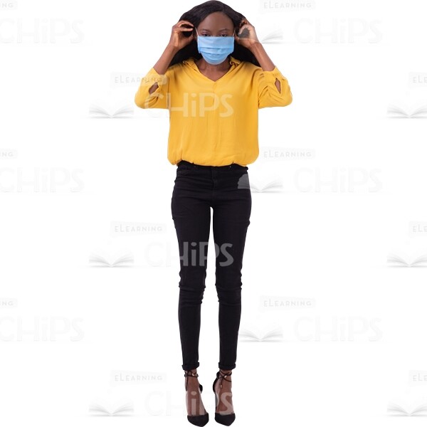 Focused Female Put On A Full Mask Arms Behind Ears Cutout Picture-0